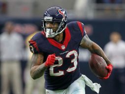 El corredor Arian Foster de los Texanos de Houston lanzó un pase que ayudó a colocar el marcador en 16-0 en el segundo cuarto. AFP / B. Levey