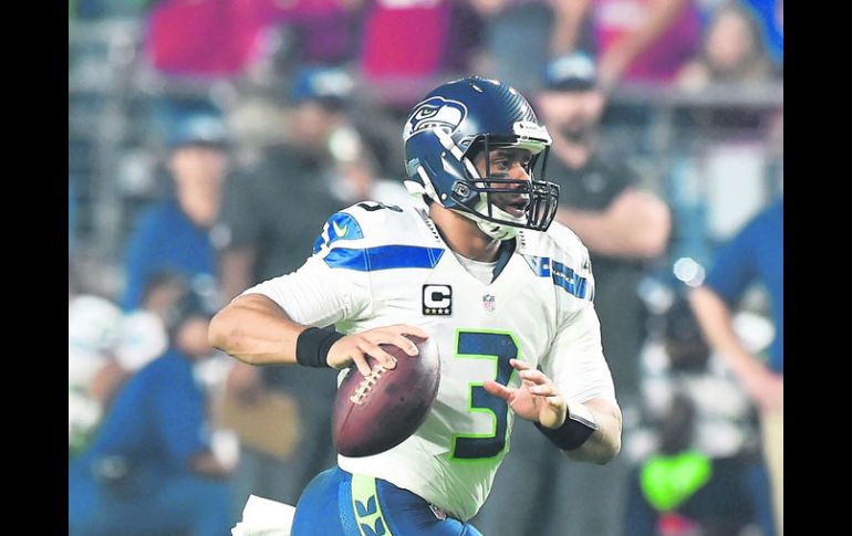 Aplastan. Arizona sólo pudo contener tres cuartos el ataque de Seattle (6-35) comandado por Russell Wilson AFP /