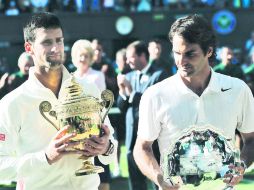 Protagonistas. Novak Djokovic (I) mantuvo a lo largo del 2014 el número uno de la ATP, pero la principal atención se la llevó Federer. AP / B. Curtis