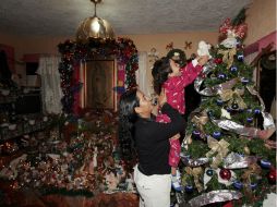 La tradición de decorar un árbol en nuestras casas tiene orígenes germanos. EL INFORMADOR / ARCHIVO