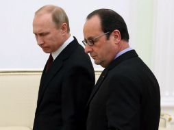 Hollande y Merkel acordaron ayer con Putin preparar para el domingo un plan para poner fin a la guerra en Ucrania. EFE / ARCHIVO