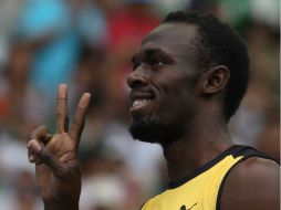 Usain Bolt aspira a convertirse en el primer hombre que gana tres veces consecutivas el oro en los 100 metros. AFP / ARCHIVO