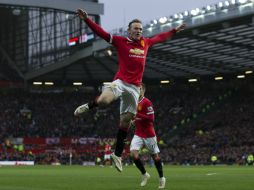 Wayne Rooney celebra luego de anotar su segundo gol. AP / J. Super