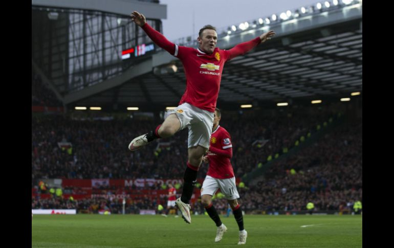 Wayne Rooney celebra luego de anotar su segundo gol. AP / J. Super