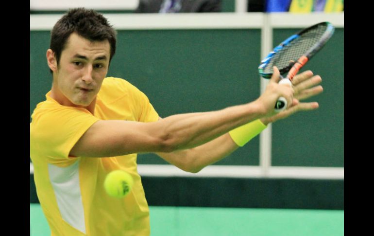 Bernard Tomic vence a Lukas Rosol y consigue su lugar en los cuartos de final. AFP / R. Mica