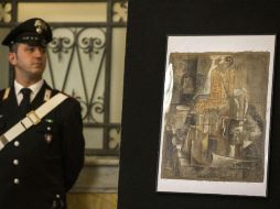 La pintura 'Violon et bouteille de Bass' se encuentra bajo vigilancia hasta comprobar la veracidad de la historia. AP / M. Percossi