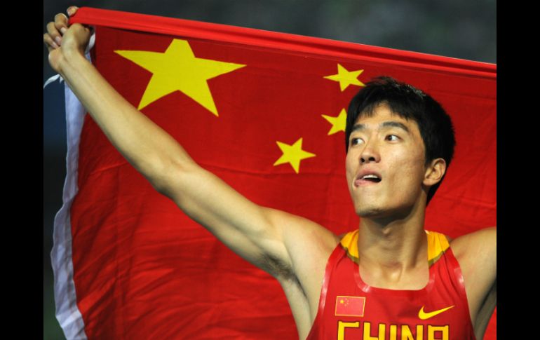 Xiang ganó oro en Atenas 2004 y entró en la historia del atletismo chino. AFP / ARCHIVO