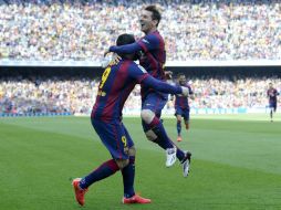 Lionel Messi celebra el segundo gol de los ''blaugranas'', el primero fue obra de Luis Suárez. AFP / J. Lago