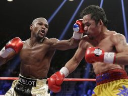 Mayweather Jr., de 38 años, que exponía los títulos del CMB y de la AMB, dejó su marca en 48-0. AP / I. Brekken