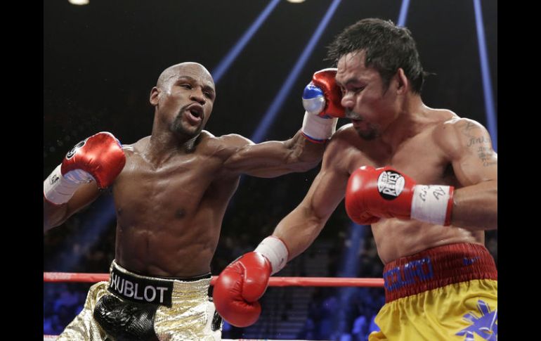 Mayweather Jr., de 38 años, que exponía los títulos del CMB y de la AMB, dejó su marca en 48-0. AP / I. Brekken