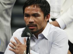 Manny reveló que semanas antes de la pelea con 'Money' sufrió una lesión en el hombro y así peleó. AP / ARCHIVO