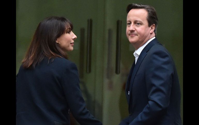 Con la victoria del partido Conservador, se garantiza el regreso del primer ministro David Cameron a Dowing Street. AFP / L. Neal