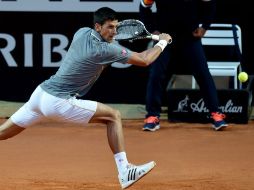 Tras un primer set complicado ante Belluci, 'Nole' fue arrollador en los siguientes dos parciales y llegó a 18 triunfos consecutivos. AFP / T. Fabi