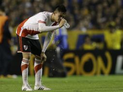 Desconocidos aventaron gas pimienta casero a los jugadores de River cuando estaban en la manga de salida directa a la cancha. AP / V. Caivano