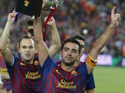 Xavi e Iniesta han compartido muchos títulos con el Barsa. AP / ARCHIVO