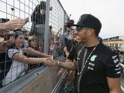 Hamilton vuelve a sonreír tras ganar en Montreal. AP / G. Hughes