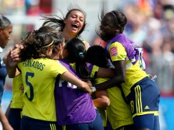 La selección femenina de Colombia festeja tras su victoria ante Francia. AFP / ELSA