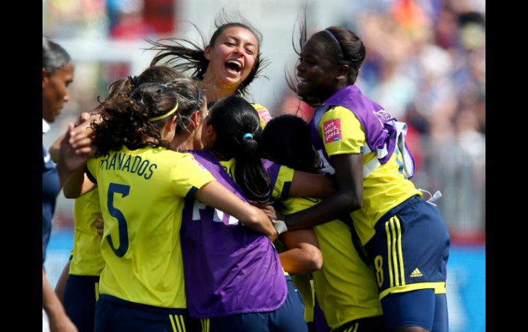 La selección femenina de Colombia festeja tras su victoria ante Francia. AFP / ELSA