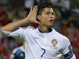 'CR7' se despidió de su selección por la puerta grande con un 'hat-trick' ante la escuadra de Armenia. AFP / K. Minsayan