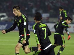 El ariete mexicano del Atlético de Madrid, Raúl Jiménez (9), celebra el segundo tanto del Tri. AP / N. Pisarenko