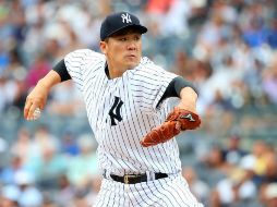 Masahiro Tanaka realiza uno de sus lanzamientos durante la primera entrada del partido de ayer entre los Yankees y los Atléticos. AFP / M. Stobe