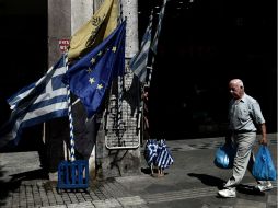 Grecia logra un acuerdo con el Eurogrupo para la restructuración de su deuda. AFP / A. Messinis