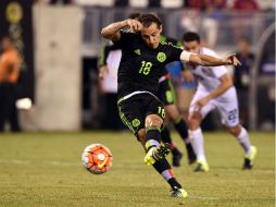 En los últimos segundos de la prórroga, Andrés Guardado ejecutó la pena máxima con la que el Tri firmó su pase a Semifinales. AFP / J. Samad