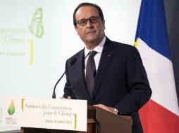 ''La crisis climática es causada por modos de vida, producción y consumo no compatibles con el desarrollo humano'', señaló Hollande. AP / E. Laurènt