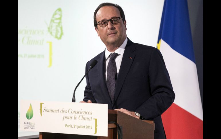 ''La crisis climática es causada por modos de vida, producción y consumo no compatibles con el desarrollo humano'', señaló Hollande. AP / E. Laurènt