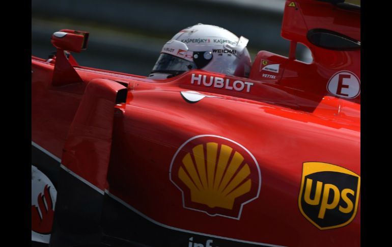 Sebastian Vettel se impuso en la carrera más emocionante del año. AFP / A. Isakovic