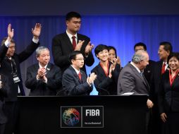 La delegación china celebró la decisión de darles la sede. AFP / T. Kitamura