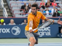 Tras conquistar el título en Wimbledon, 'Nole' volvió a la escena en las canchas canadienses para imponerse. AFP / M. Panagiotakis