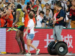 Bolt se levantó finalmente unos instantes más tarde. AP / N. Guan