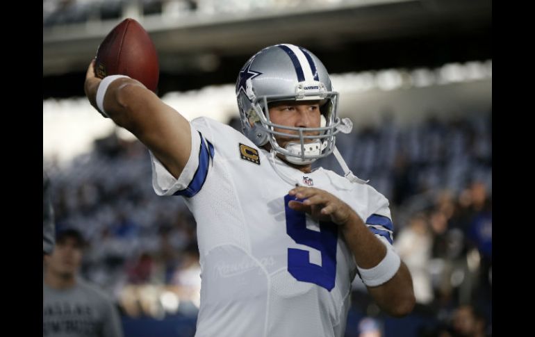 Tony Romo lanzó tres pases de anotación. AP / B. Wade