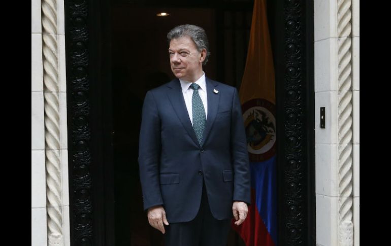 Santos afirma que su paso por EU significó una 'gira muy positiva para el país' tras el compromiso con las FARC. AP / J. DeCrow