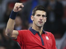 El tenista serbio Novak Djokovic celebra tras ganar al estadounidense John Isner en su partido de cuartos de final. EFE / H. H. Young