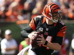 Dalton lanzó para un pase de touchdown, corrió para otro y condujo a los Bengalíes en una ofensiva de 69 yardas sin pedir tiempo. AFP / A. Lyons