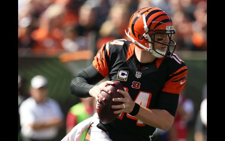 Dalton lanzó para un pase de touchdown, corrió para otro y condujo a los Bengalíes en una ofensiva de 69 yardas sin pedir tiempo. AFP / A. Lyons