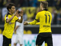 El equipo de Dortmund no quiere despegarse del líder. AFP / O. Andersen