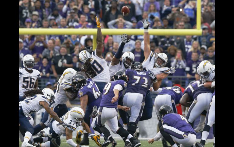 Los Cuervos de Baltimore se sobrepusieron a tres pases de touchdown de Philip Rivers. AP / P. Semansky