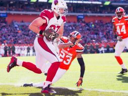 Carson Palmer lanzó cuatro pases para anotación, tres de ellos en la segunda mitad, y totalizó 374 yardas por aire. AFP / J. Miller