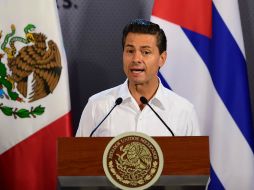 Peña Nieto señala que una decisión histórica da causa a una nueva agenta trialteral de México, Cuba y EU. AFP / R. Schemidt