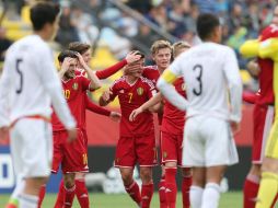 Los jugadores de Bélgica celebran al vencer a México y obtener el tercer lugar del torneo. EFE / M. Ruiz