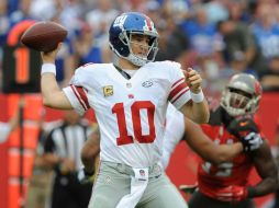 Eli Manning lanzó para 213 yardas con dos touchdowns. AFP / C. McBride