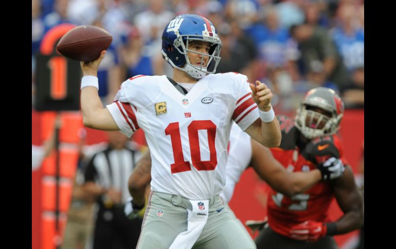 Eli Manning lanzó para 213 yardas con dos touchdowns. AFP / C. McBride