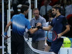 Djokovic (izq) deberá batir al checo Thomas Berdych el jueves para asegurarse el pase a la penúltima ronda. AFP / T. Ireland