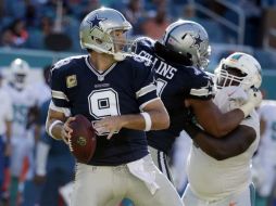 Romo lanzó dos pases de anotación y completó 18 de 28 pases para 227 yardas. AP / L. Sladky