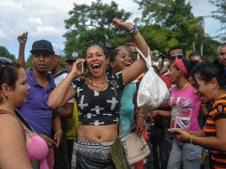 Los cubanos que compraron sus boletos aéreos antes del 26 de noviembre, recibirán la visa. AFP / Y. Lage