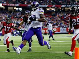 Adrian Peterson corrió para 158 yardas y dos anotaciones. AFP / K. Cox