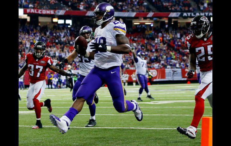 Adrian Peterson corrió para 158 yardas y dos anotaciones. AFP / K. Cox